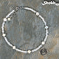 Freshwater Pearl and White Seed Bead Choker Necklace with Silver Plated Spacers beside a dime.