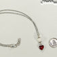 Lava Rock and Heart Shaped July Birthstone Choker Necklace beside a dime.
