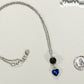 Lava Rock and Heart Shaped December Birthstone Choker Necklace beside a dime.