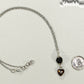 Lava Rock and Heart Shaped November Birthstone Choker Necklace beside a dime.