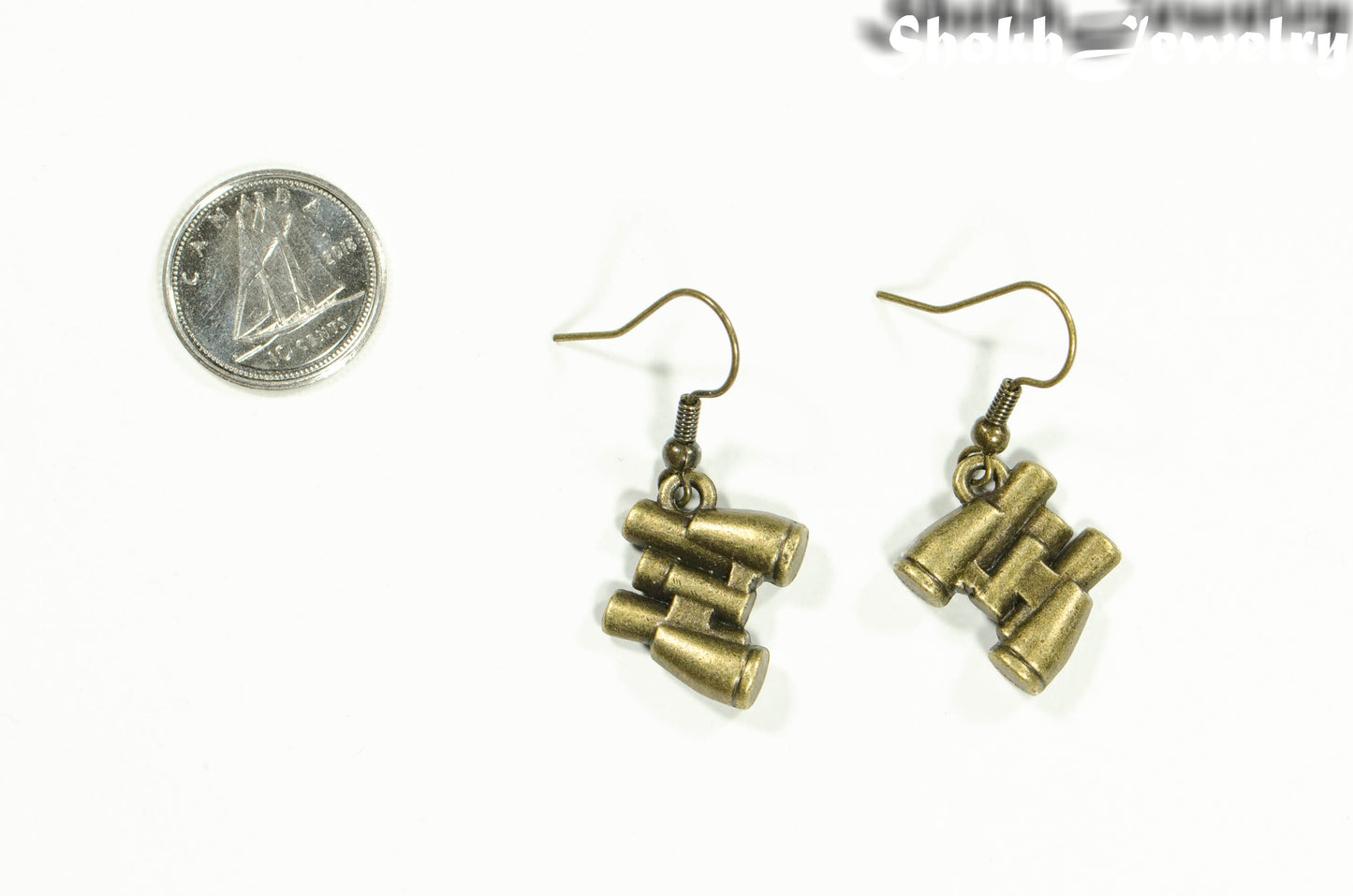 Antique Bronze Binocular Charm Earrings beside a dime.