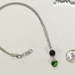 Lava Rock and Heart Shaped August Birthstone Choker Necklace beside a dime.