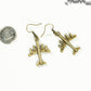 Antique Bronze 3D Plane Charm Earrings beside a dime.