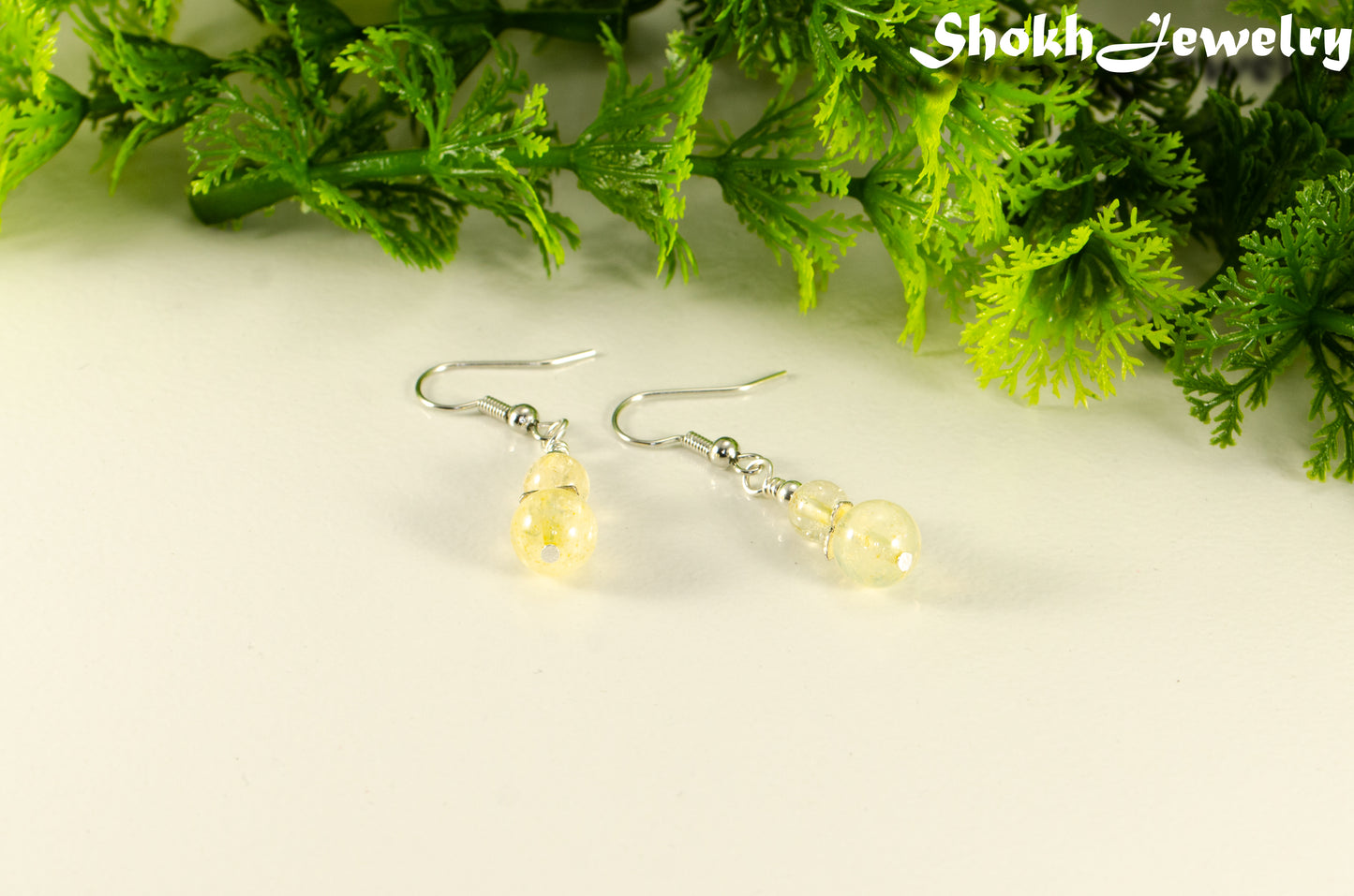 Small Natural Citrine Crystal Earrings with silver tone ear wires.