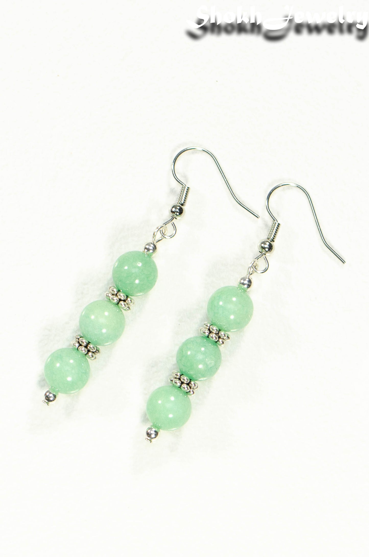 Top view of Natural Mint Green Quartz Beaded Bar Earrings.