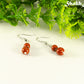 Small Natural Red Jasper Earrings with silver tone ear wires.