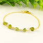 Close up of Peridot Crystal Chip and Gold Plated Chain Bracelet.