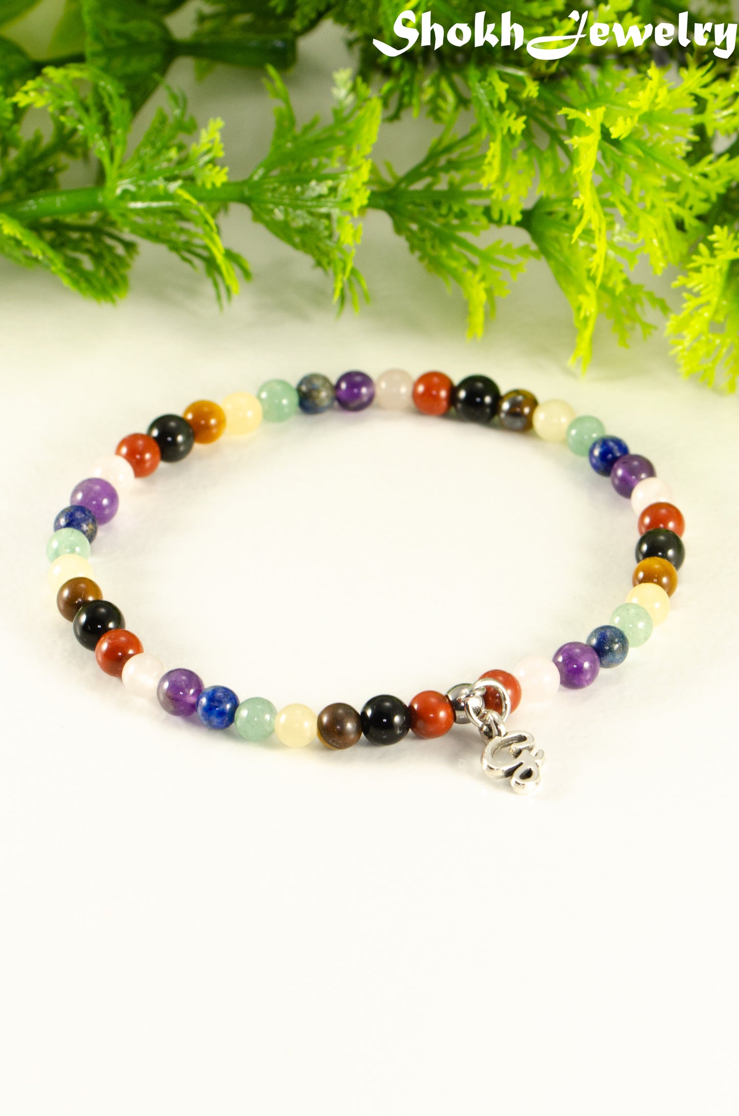 Close up of Dainty Gemstone Chakra Bracelet with Initial.