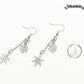 Long Chain and Snowflakes Charm Earrings beside a dime.