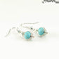 Turquoise Howlite Wire Wrapped Earrings with silver tone ear wires.