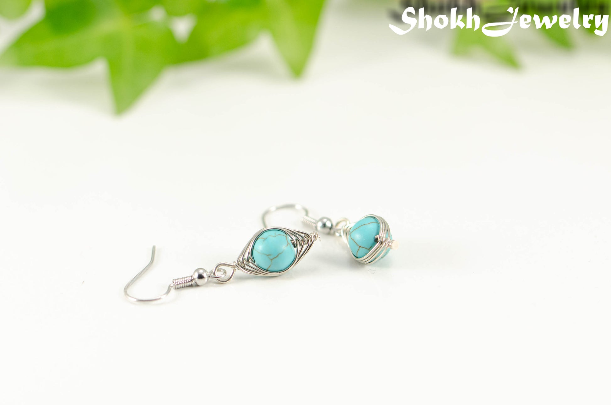 Close up of Turquoise Howlite Wire Wrapped Earrings.