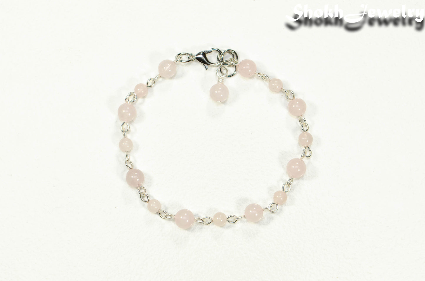 Top view of Handmade Rose Quartz Link chain anklet.