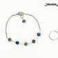Lapis Lazuli and Stainless Steel Chain Anklet beside a dime.