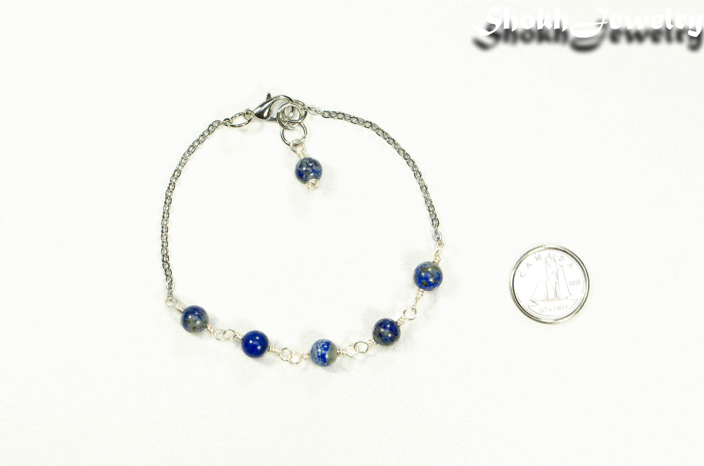 Lapis Lazuli and Stainless Steel Chain Anklet beside a dime.