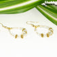 Clear Glass Crystal and Gold Hoop Earrings with gold tone ear wires.