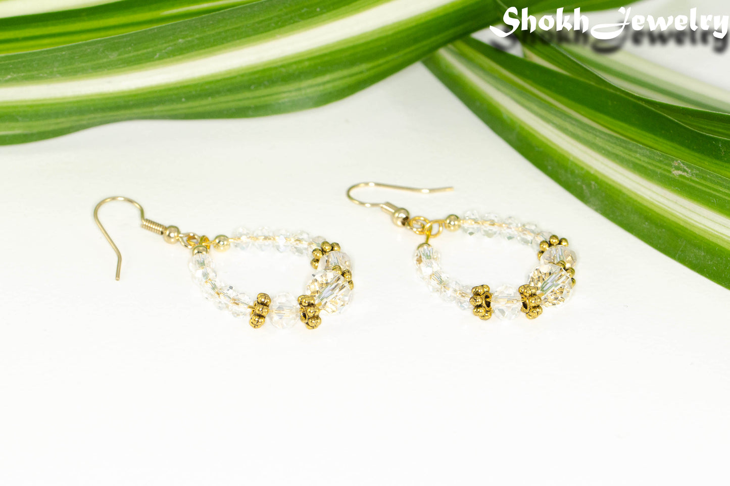 Clear Glass Crystal and Gold Hoop Earrings with gold tone ear wires.