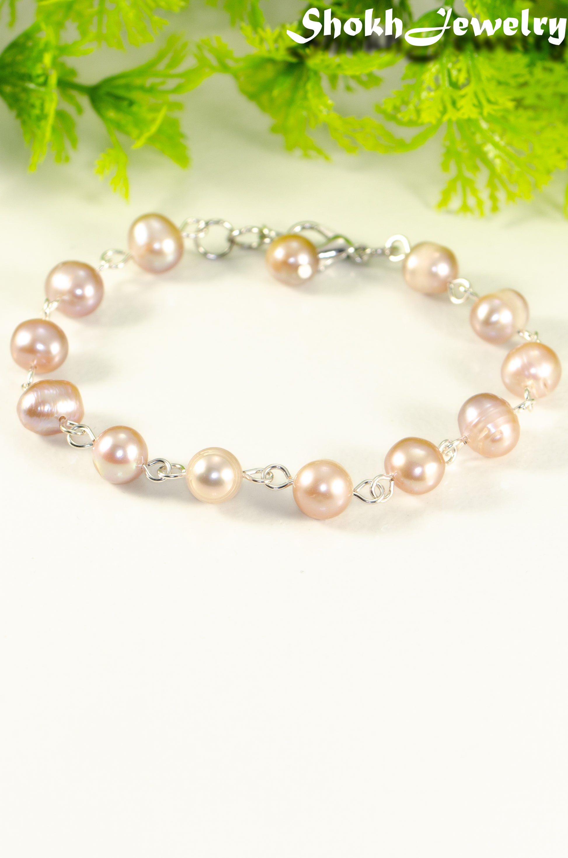Close up of Lavender Freshwater Pearls Link Chain Bracelet.
