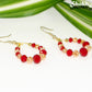 Red and Gold Glass Crystal Hoop Earrings with gold tone ear wires.