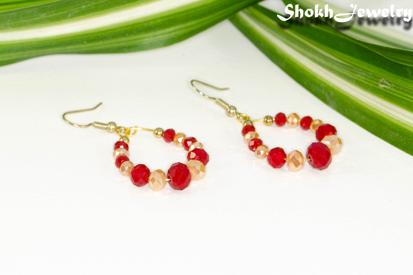 Red and Gold Glass Crystal Hoop Earrings with gold tone ear wires.