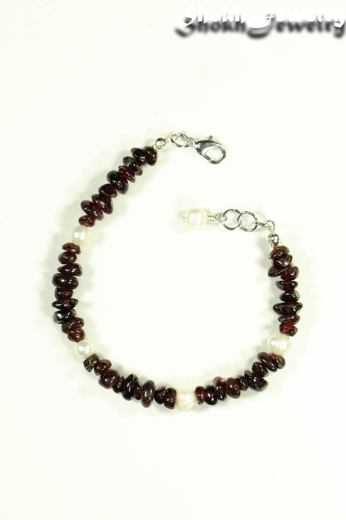 Top view of Natural Garnet Crystal Chip and Pearls Bracelet.