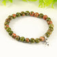 Close up of 6mm Unakite Bracelet with Initial.