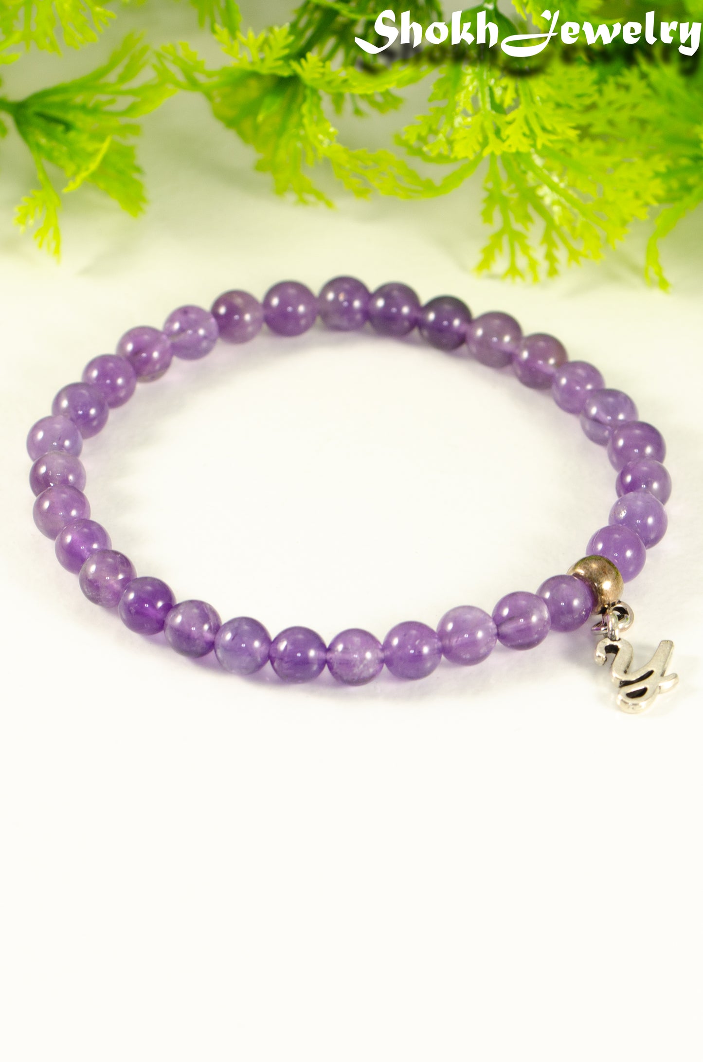 Close up of 6mm Amethyst Bracelet with Initial.