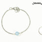 8mm Aquamarine and Chain Anklet beside a dime.