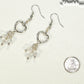 Silver Plated Heart and Clear Glass Crystal Cluster Earrings beside a dime.