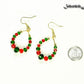 Green and Red Glass Crystal Hoop Earrings beside a dime.