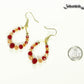 Red and Gold Glass Crystal Hoop Earrings beside a dime.