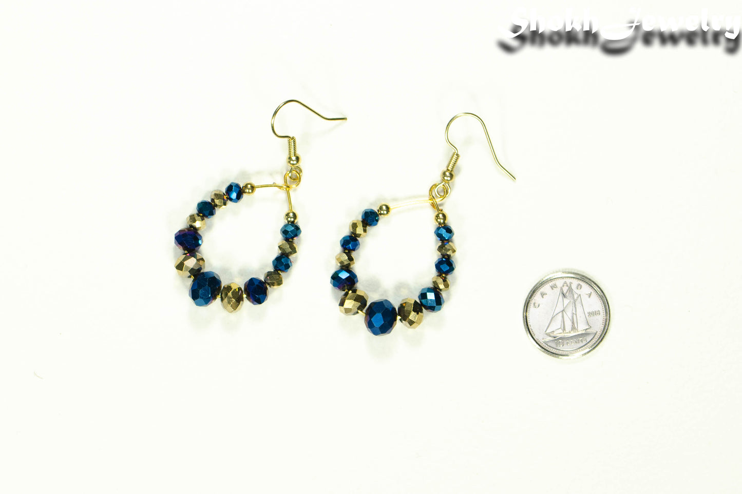 Blue and Gold Glass Crystal Hoop Earrings beside a dime.