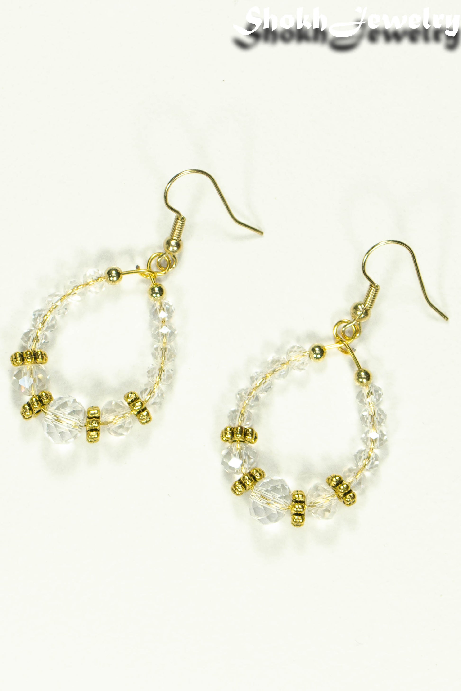 Top view of Clear Glass Crystal and Gold Hoop Earrings.