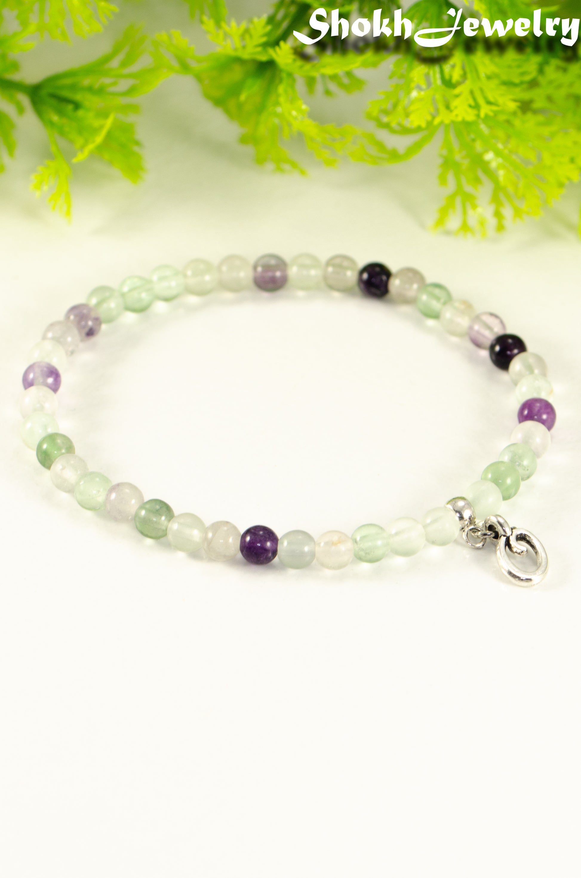 Close up of 4mm Rainbow Fluorite Bracelet with Initial.