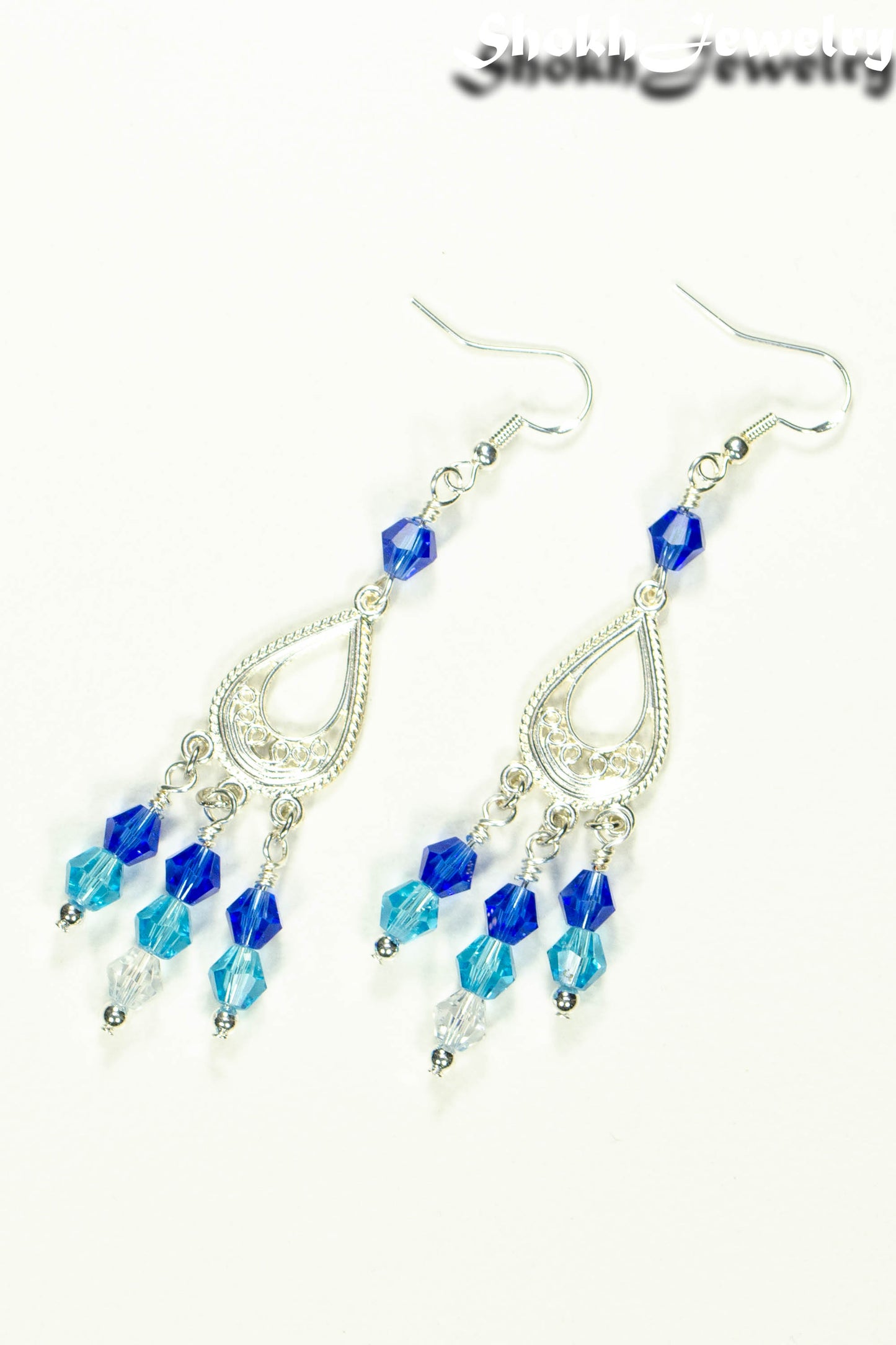 Top view of Ombre Blue Glass Crystal Chandelier Earrings.