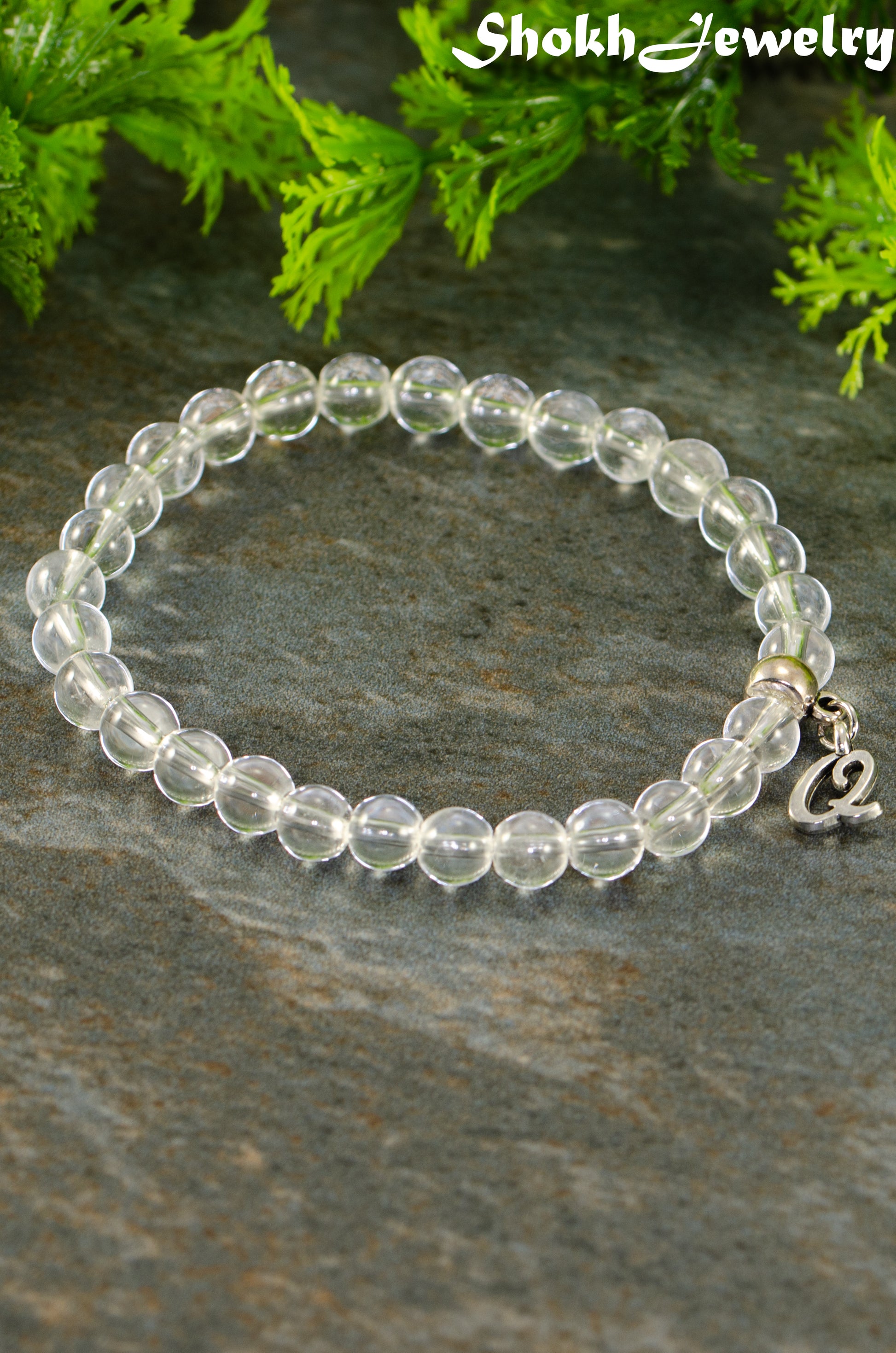 Close up of 6mm Clear Quartz Bracelet with Initial.