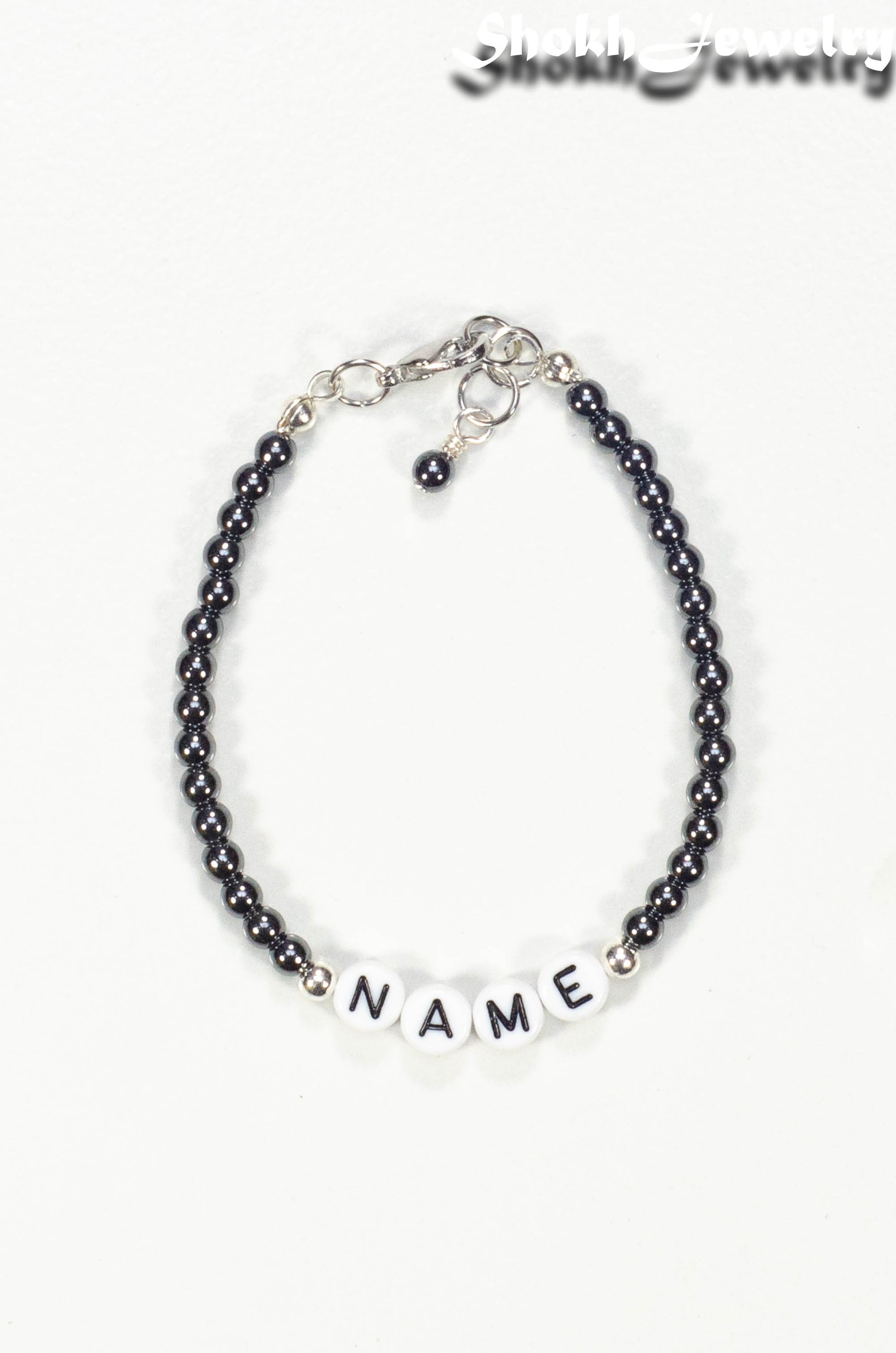 Top view of Personalized Hematite Stone Name Bracelet with Clasp.