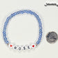 Blue Seed Beads Name Bracelet beside a dime.