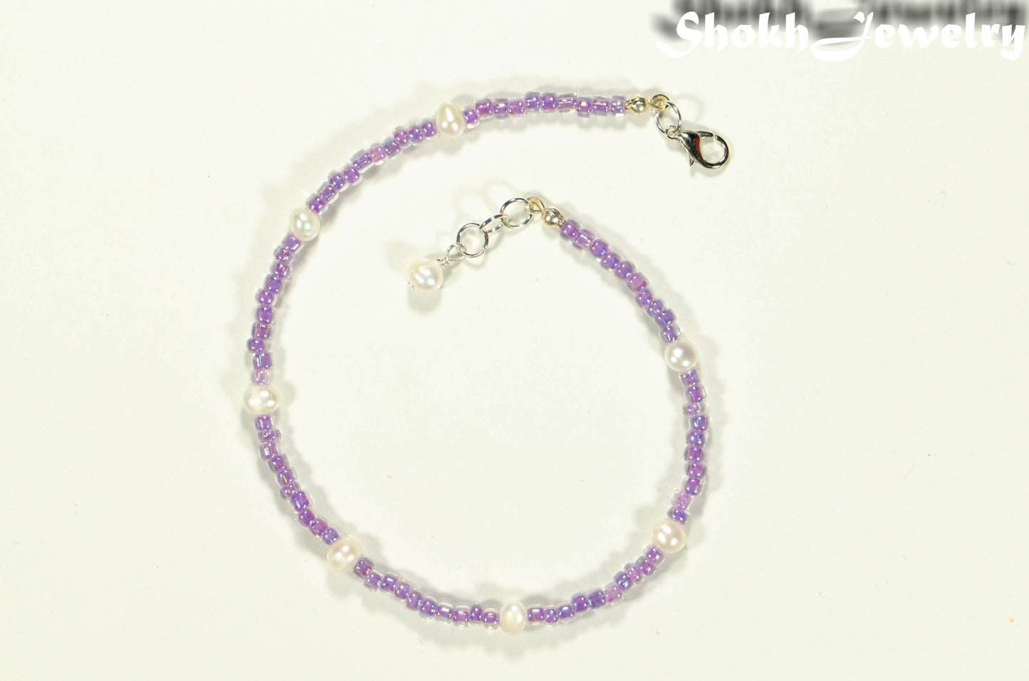 Top view of Freshwater Pearl and Purple Seed Bead Anklet.