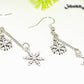 Close up of Long Chain and Snowflakes Charm Earrings.