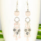 Close up of Statement Rose Quartz and Heart Chandelier Earrings.