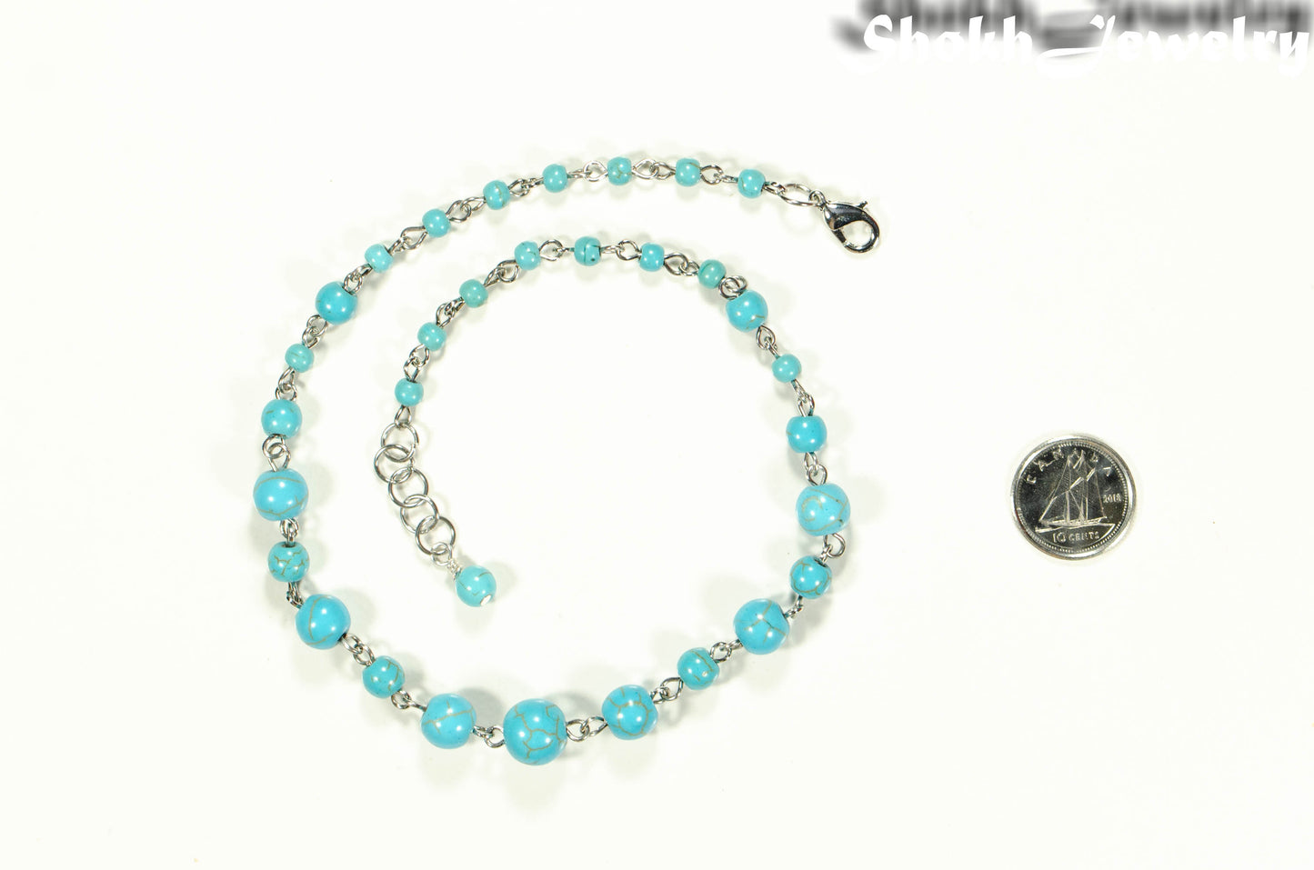 Handmade Turquoise Howlite Link Chain Anklet beside a dime.