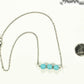 Turquoise Howlite and Dainty Chain Choker Necklace beside a dime.