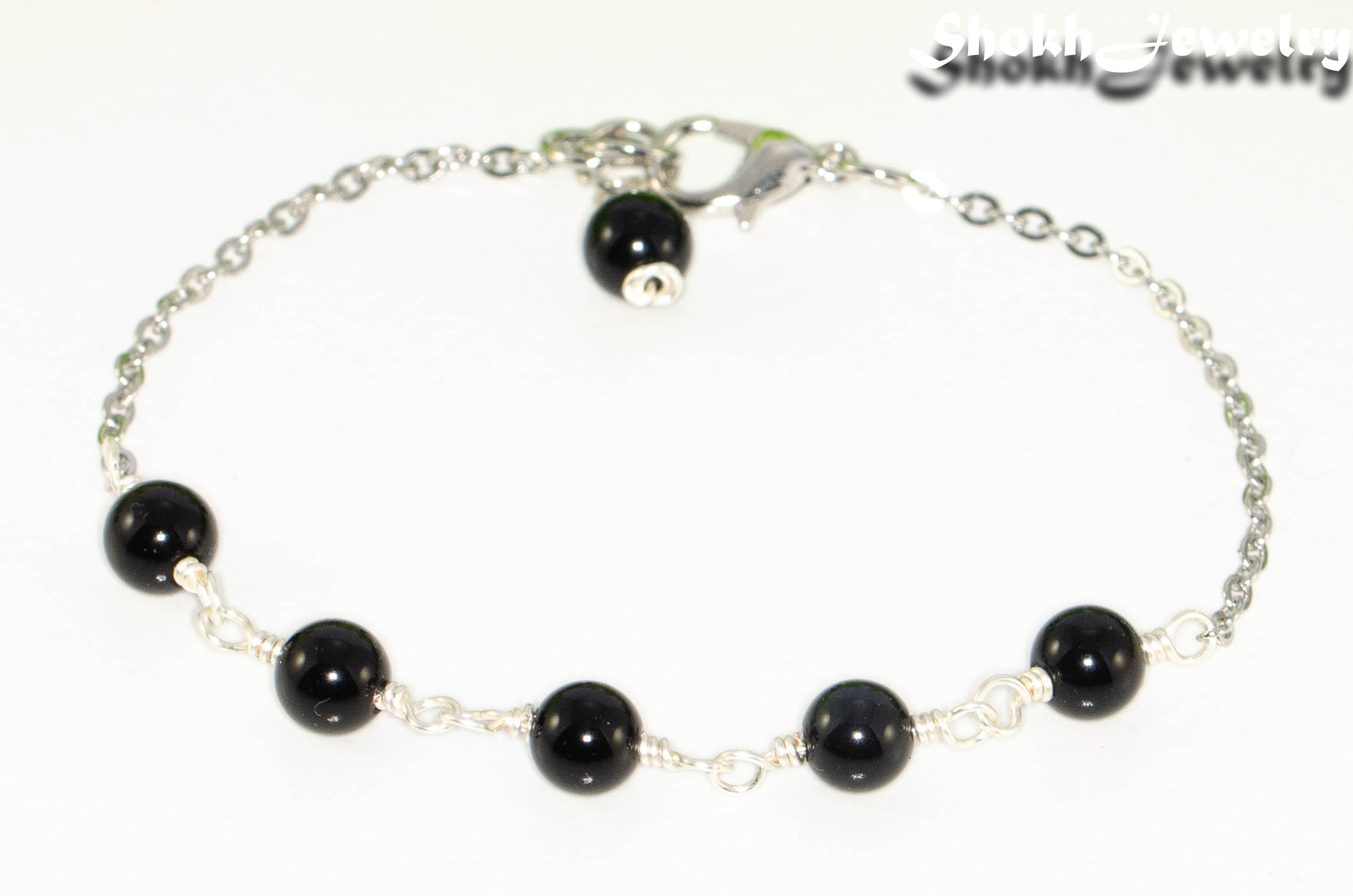 Close up of Black Obsidian and Stainless Steel Chain bracelet.