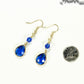 Blue Glass Teardrop Dangle Earrings beside a dime.