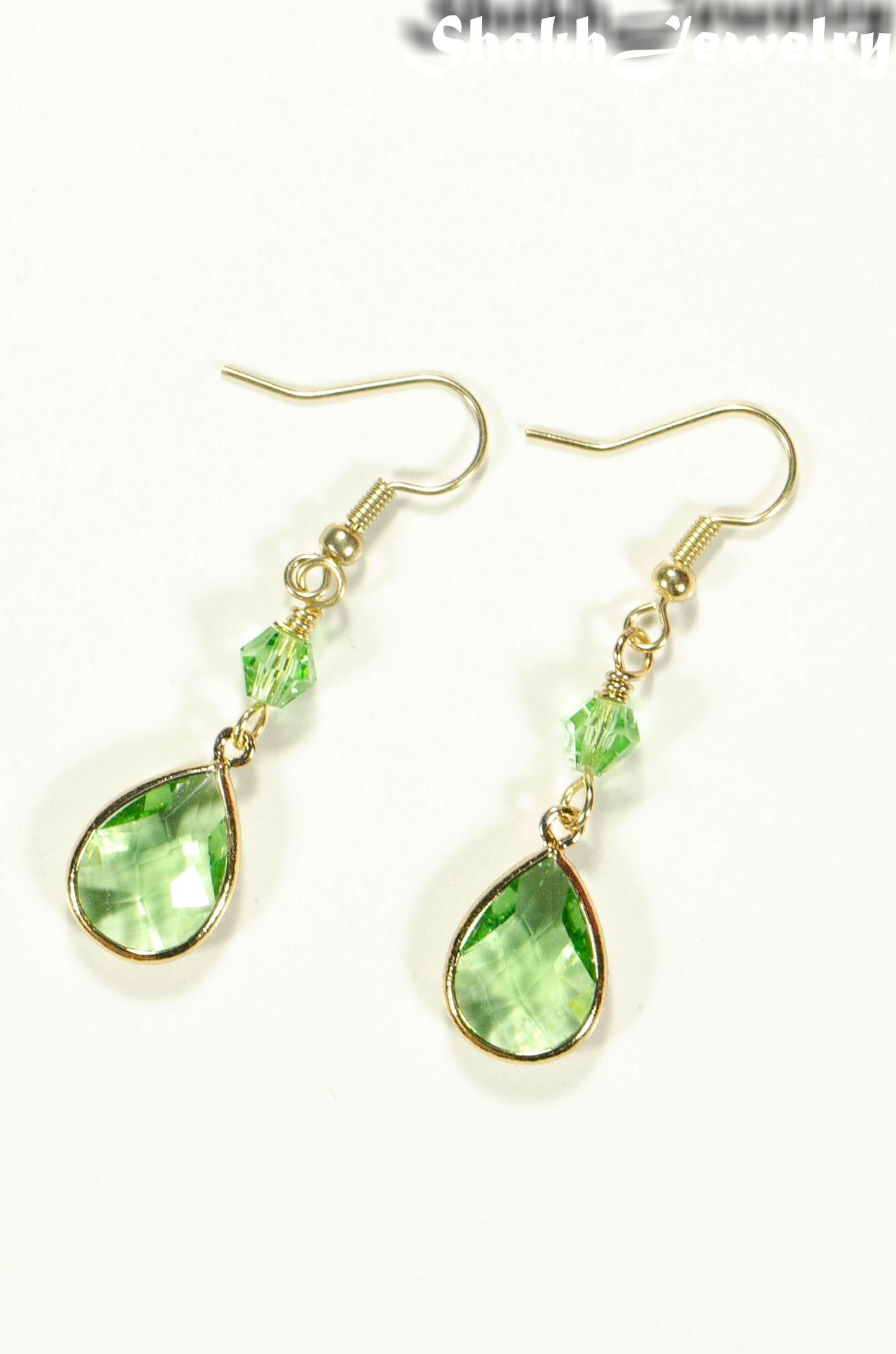 Top view of Green Glass Teardrop Dangle Earrings.