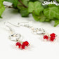 Close up of Silver Plated Heart and Red Glass Crystal Cluster Earrings.