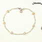 Lavender Freshwater Pearl and Chain Anklet beside a dime.