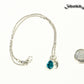 Small Personalized March Birthstone Choker Necklace beside a dime.