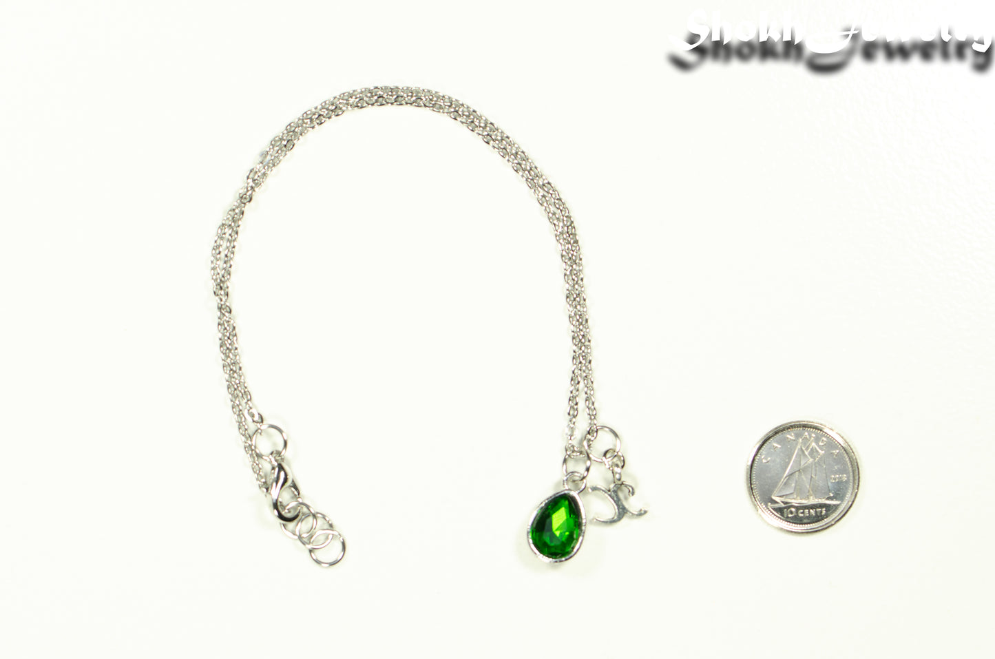 Small Personalized May Birthstone Choker Necklace beside a dime.