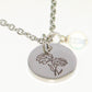 Close up of October Birth Flower Necklace with White Opal Birthstone Pendant.